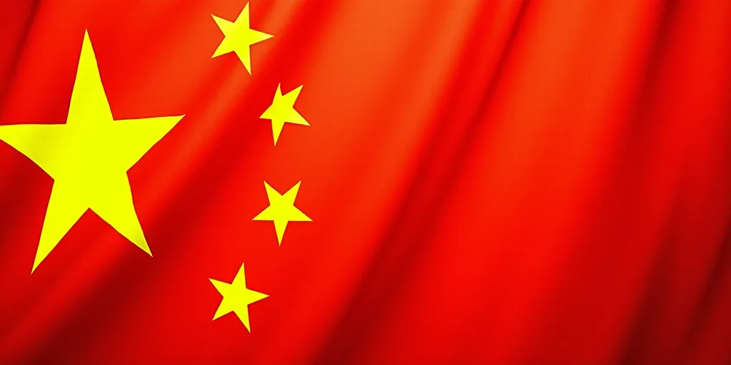 a close up of a flag with a red background and a yellow one with white stars on it and a red one wit