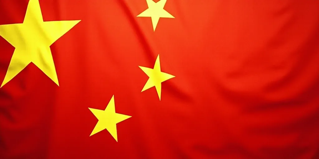 a close up of a flag with a red background and a yellow one with white stars on it and a red one wit