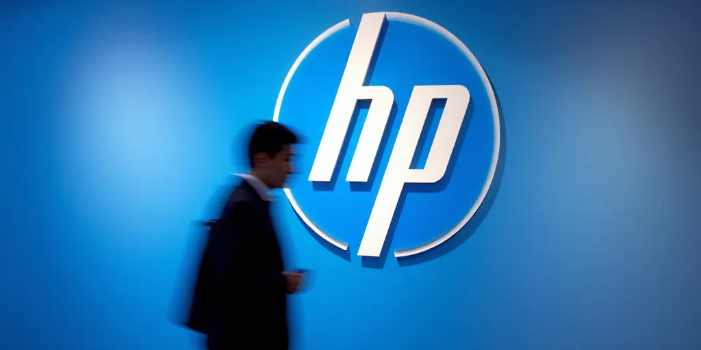 a man walks past a logo of the hp corporation at a booth in tokyo, japan, on march 18, 2013, Avgust