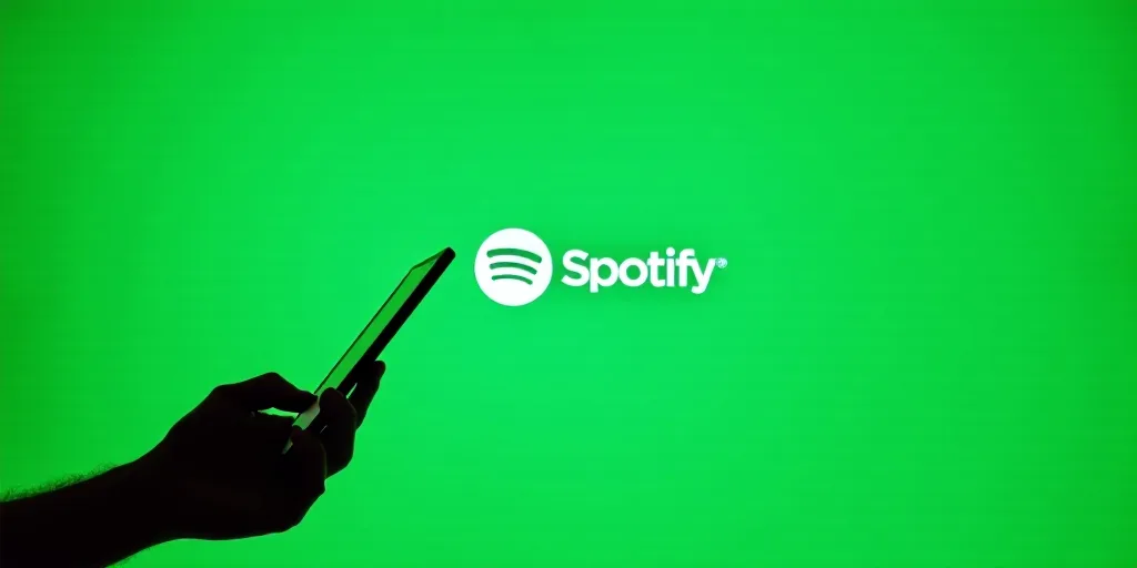 a hand holding a cell phone in front of a spotify sign with a green background and spotify logo, Ai-